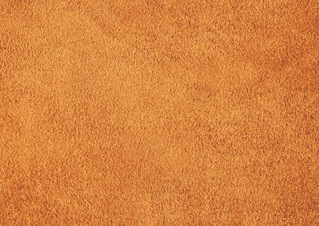 Genuine suede material. Brown background.の写真素材