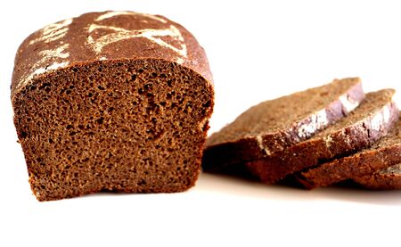 Slices of fresh black Borodino bread on a white background.