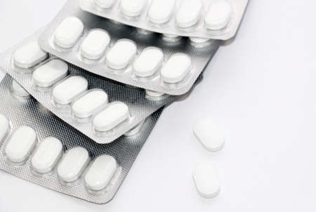 White pills. Blister with pills on a white background.の写真素材