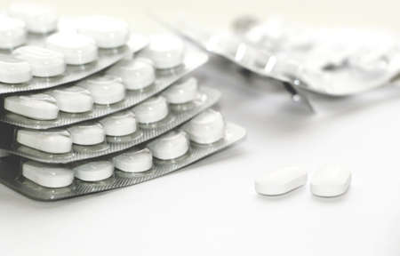 White pills. Blister with pills on a white background.の写真素材