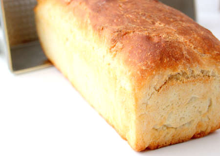 Homemade white wheat bread with a crispy crust. Baking with hand-kneaded yeast dough.