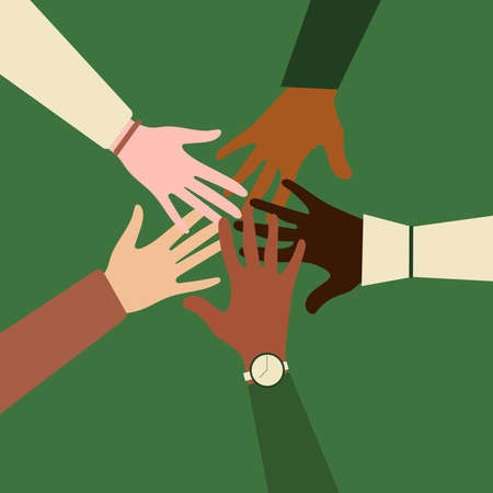 Hands of people of different nationalities and religions together. The concept of community, support, partnership, teamwork, social movement, friendship and cooperation. Green background.の写真素材
