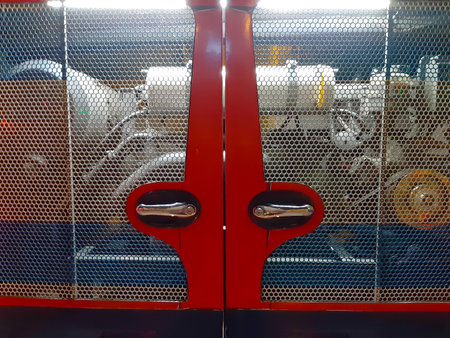 Open door of engine on the bus in Thailand.