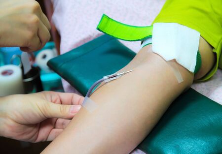 Nurse and patient blood samples  Donated blood in blood lab の写真素材