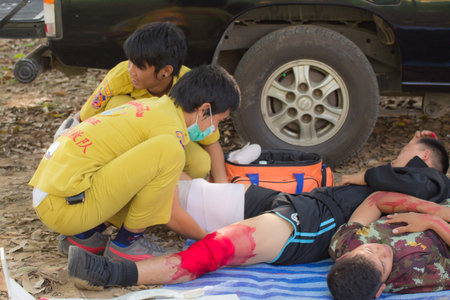 PHRAE,THAILAND - DECEMBER 20 : Unidentified  men are first aid training from staff  the hospital on  December 20, 2012 at local parks, Muang, Phrae, Thailand.のeditorial素材