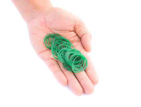 Green rubber bands in handの写真素材