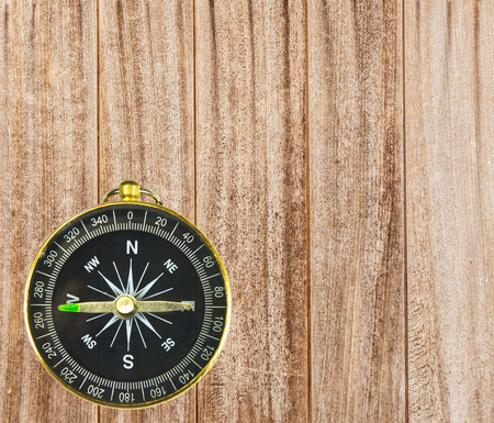 Wood texture and small pocket compass  old panelsの写真素材
