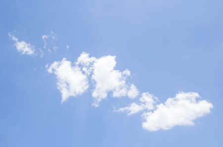 Blue sky background with white cloudsの写真素材