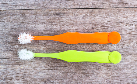 An old toothbrush on the wood backgroundの写真素材