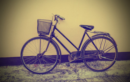 Vintage Bicycle Against Grunge Wallの写真素材