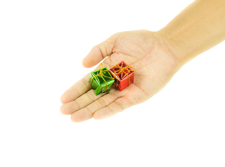 Two small gift box in hand holding on wihte backgroundの写真素材