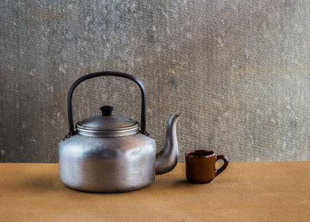 Vintage still life with Kettle on wooden backgroundの写真素材