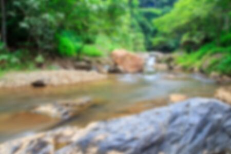 Blur background with water fall in the natureの写真素材