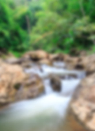 Blur background with water fall in the natureの写真素材