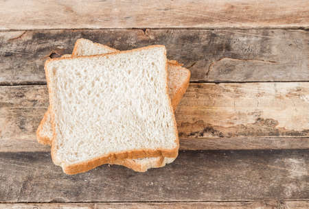 Slice bread on a wooden backgroundの写真素材