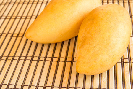 Close up mango ripe on a wooden backgroundの写真素材