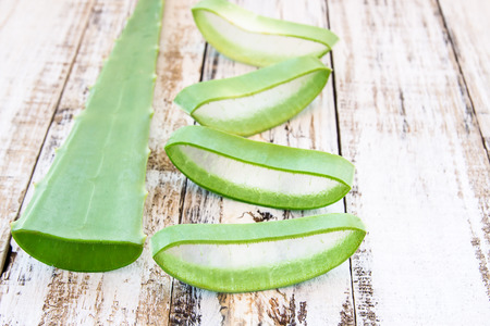 Close up Aloe Vera leaves on wooden backgroundの写真素材