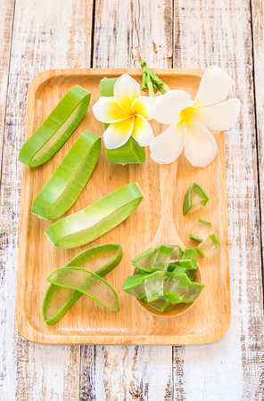 Close up Aloe vera in wooden plate on wooden backgroundの写真素材