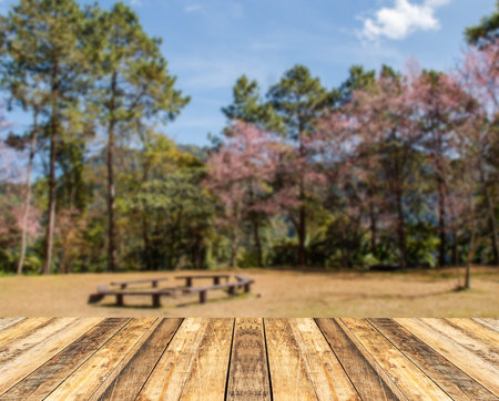 Old wooden table with blurred background for any designの写真素材