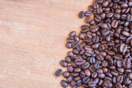 Coffee beans on grunge wooden background for any designの写真素材