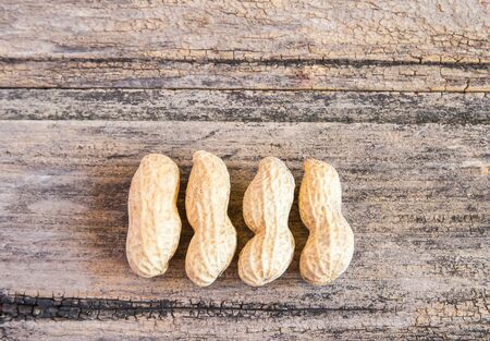Close up peanuts on a wooden table backgroundの写真素材