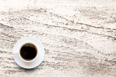 Coffee cup on white wooden table background. top viewの写真素材