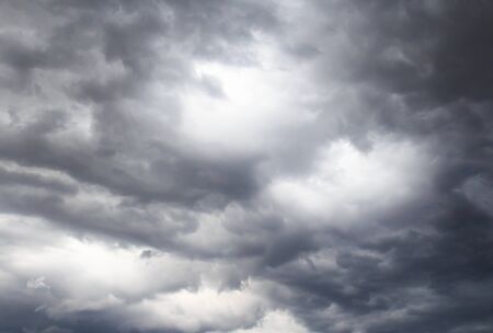 Dark storm clouds before rain, with strange cloud shapesの写真素材