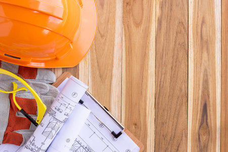 Architecture plan and rolls of blueprints with tool kit for the project engineer jobs