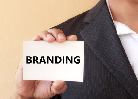 BRANDING word on the white card presenting by a businessmanの写真素材