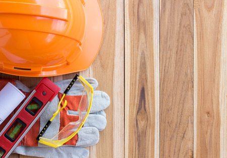 Safety equipment and tool kit on wooden table background with copy spaceの写真素材