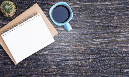 Top view smart phone and cup of coffee on office desk with copy space.の写真素材