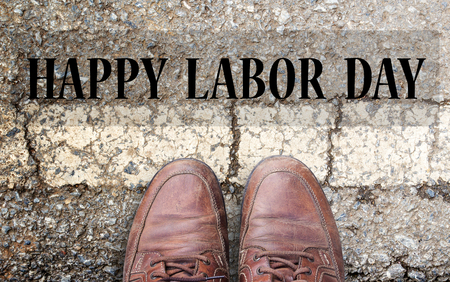 Labor Day is a federal holiday of United States America.Top view with Brown leather shoes on the cement road background. space for use and any design. Business and labor day concept.の写真素材