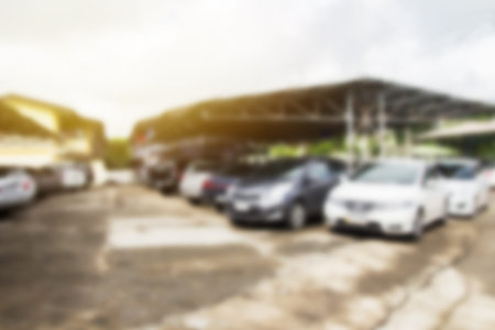 Defocused and blur image with morning sunlight of car park in outdoor parking.Copy space background for usage and any design.の写真素材