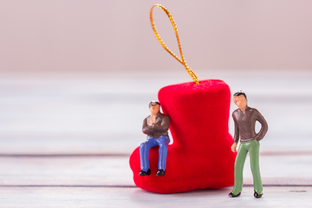 Miniature people : Businessman figures standing on the floor with blurred christmas decoration background. money and financial concept. copy space for use as christmas and new year concept.の写真素材