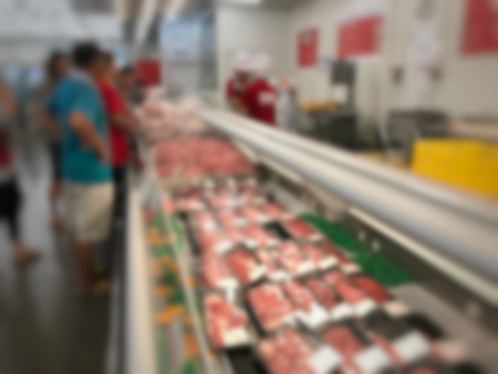 supermarket blur background for design. Blurred supermarket, grocery with customers shopping, bokeh light background. Healthy concept.の写真素材