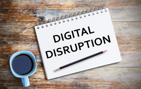 Text with digital disruption and coffee cup, notebook,pencil on grunge wooden table. Top view with copy space (selective focus). Office desk table,food and drink ,business concept.の写真素材