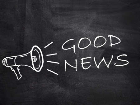 Good News text with megaphone on chalkboard background. Concept with inspiration and motivation.の写真素材