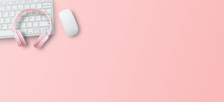 Top view with call center desktop, headset and accessories on pink table background. Panoramic banner for business marketing design. copy spaceの写真素材