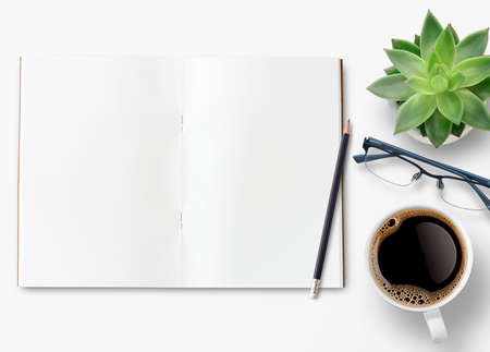 Blank notebook, offee,glasses and other office equipment on white office desk. Top view with copy space, flat lay.の写真素材