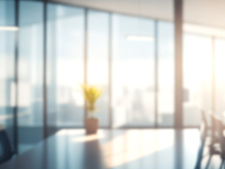 Blurred image of mordern office with sunlight for background usage. Blur interior background concept.の写真素材