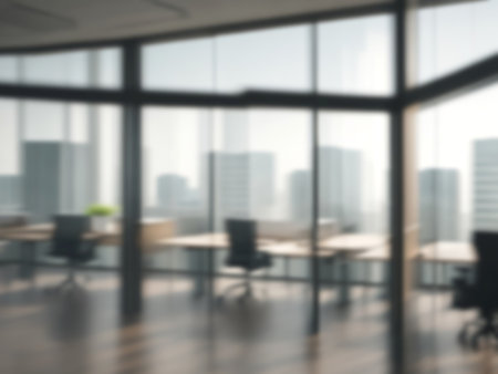 Blurred image of mordern office with sunlight for background usage. Blur interior background concept.の写真素材
