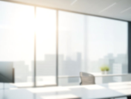 Blurred image of mordern office with sunlight for background usage. Blur interior background concept.の写真素材