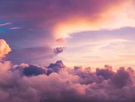 Dramatic amazing sky and clouds from above at sunset.Colorful pastel sky backgroundの素材