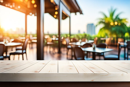 Empty wood tabletop or counter with display product. Blur image of restaurant,coffee shop...