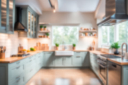 Blur image of kitchen room with furniture at home with sunlight for background usage. blur interior concept.の素材