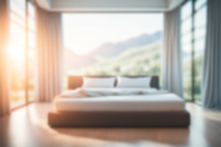 Blur image of bed room with furniture at home with sunlight for background usage.の素材