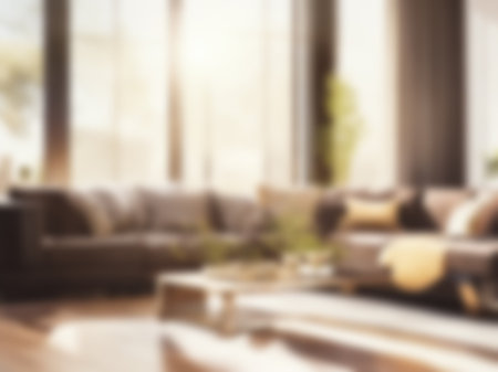 Blur living room at home with morning sunlight at big window for background usage. blur interior background concept.britht tone.の素材
