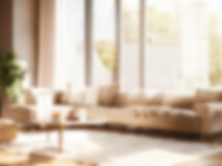 Blur living room at home with morning sunlight at big window for background usage. blur interior background concept.britht tone.の素材
