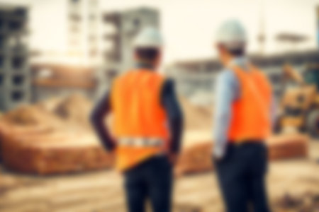 Blur images of workers in construction site. Silhouette Engineer and construction team working at site.の素材