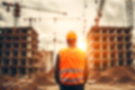 Blur images of workers in construction site. Silhouette Engineer and construction team working at site.の素材